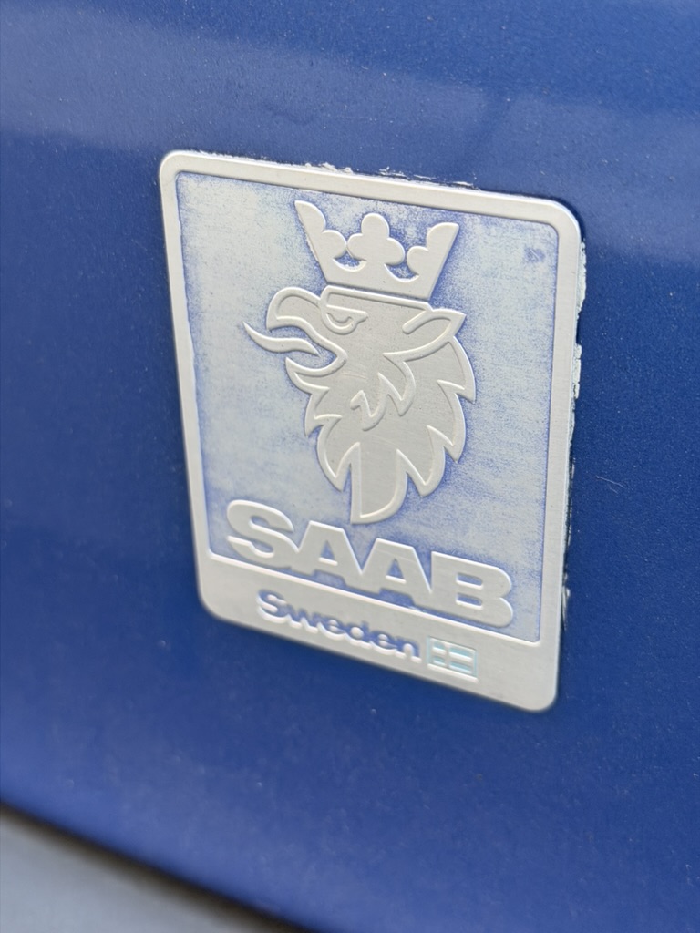 SAAB Sweden griffin grille badge on Lightning Blue paint